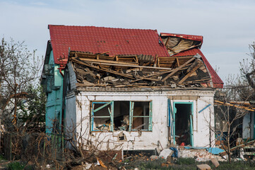 A destroyed house in a Ukrainian village, ruins after shelling, bombing, explosion in Ukraine. War...