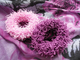 Unusual women's jewelry large elastic bands for hair in a lilac-pink range.