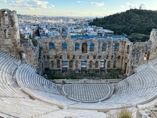 View of the Theatre of Dionysus with the city skyline in the background. Athens, Greece
