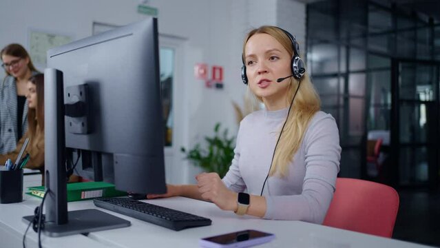 Portrait Of Woman Consultant Of Hotline Consulting Clients By Call In Call-Center Of Bank