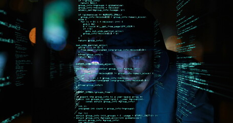Image of digital interface with data processing over hacker in hood using torch on cityscape
