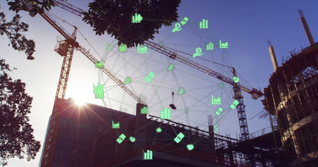 Image of a globe made of web of connections spinning over a cityscape