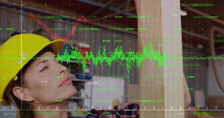 Image of a green graph forming on a grid over Caucasian female worker looking at the camera