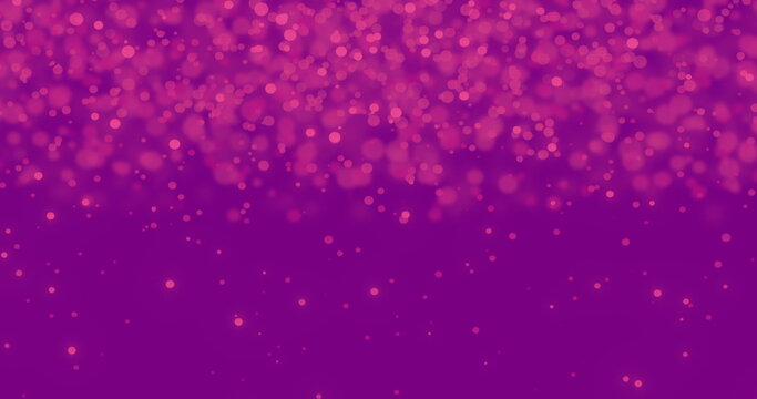Image of multiple pink particles falling on a purple background