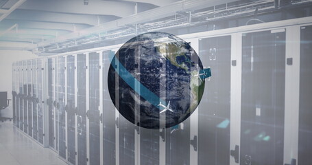 Digital image of airplane icons flying around the globe against empty server room