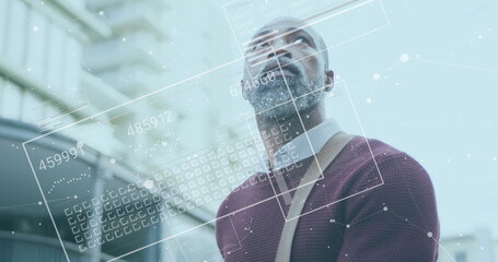 Image of financial data processing over african american man in city