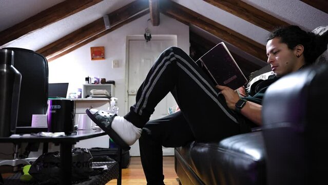 Writer jotting down their thoughts in a notebook in a room