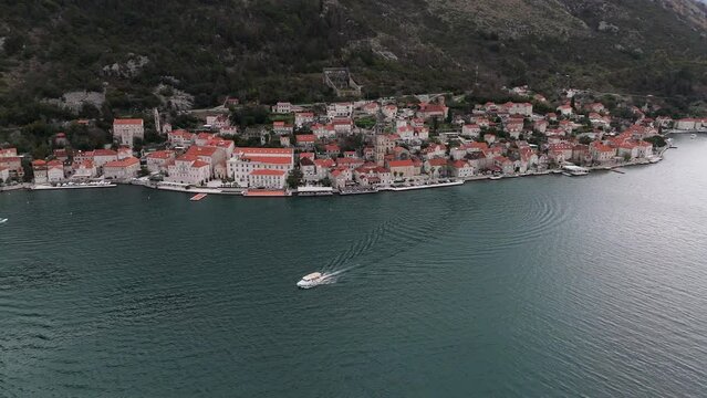 4K drone shot captures the charming town of Perast, Montenegro, renowned for its Baroque architecture and maritime heritage. Enjoy a stunning view of UNESCO-listed Bay of Kotor