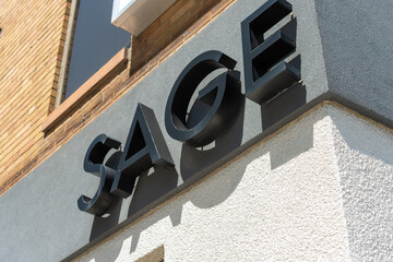 Fototapeta premium exterior building and sign of Sage Real Estate Ltd located at 2010 Yonge Street in Toronto, Canada