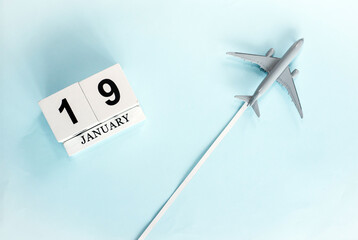 January calendar with number  19. Top view of a calendar with a flying passenger plane. Planner for...