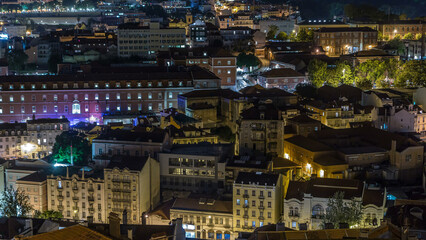 Fototapeta na wymiar Lisbon aerial view of city centre with illuminated building at night timelapse, Portugal