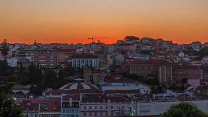 Sunrise over Lisbon aerial cityscape skyline timelapse from viewpoint of St. Peter of Alcantara,...