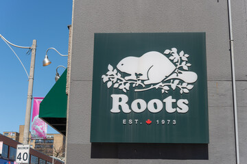 Obraz premium exterior sign at Roots, a clothing store chain, located here at 1485 Yonge Street (near St Clair Avenue East) in Toronto, Canada