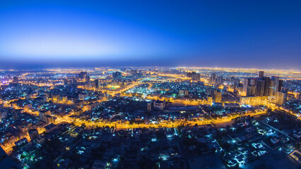 Cityscape of Ajman from rooftop night to day timelapse. Ajman is the capital of the emirate of...