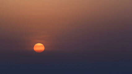 Sunrise with cityscape of Ajman from rooftop aerial timelapse.