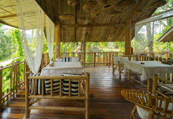 Fototapeta premium Thai restaurant with nature forest trees. Interior design.