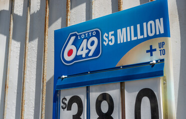 Obraz premium Lotto 649 jackpot sign fixed to the exterior of a building Toronto, Canada