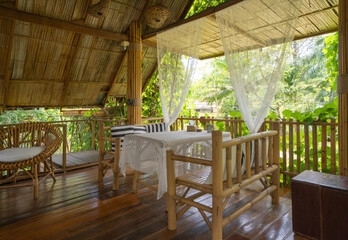 Thai restaurant with nature forest trees. Interior design.