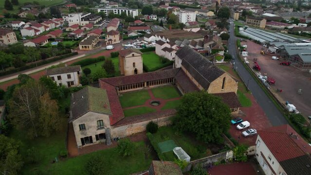 circular drone shot around the cordeliers convent in Saint nizier sous charlieu, Loire department, auvergne rhone alpes region, france