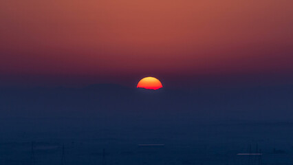 Beautiful sunrise in lonely desert and mountain in the background timelapse, Ajman, UAE