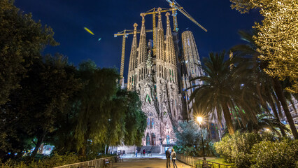 Sagrada Familia, a large church in Barcelona, Spain night timelapse hyperlapse.