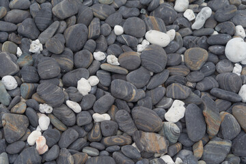 Granite gravel stone rocks flooring pattern surface texture. Close-up of exterior material for...