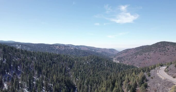 Aerial view of a New Mexico mountain valley and a rural highway