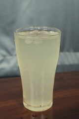 glass of lemon juice on wooden table