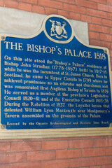 Obraz premium historical plaque of The Bishop's Palace 1818 (located at the northwest corner of Front Street West and University Avenue) in downtown Toronto, Canada