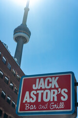 Obraz premium exterior sign of Jack Astor's Bar & Grill with nearby buildings located at 144 Front Street West in Toronto, Canada