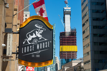 Obraz premium exterior sign of Loose Moose / Antler Room, a bar & grill, located at 146 Front Street West in downtown Toronto, Canada