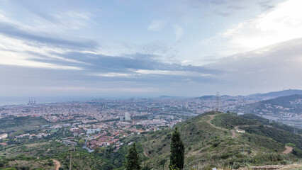 Barcelona and Badalona skyline with roofs of houses and sea on the horizon at evening timelapse