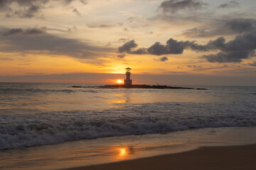 Fototapeta premium Lighthouse tower, Khao Lak with seawater, Andaman sea in Phang Nga Bay island in summer season, Thailand. Tourist attraction.