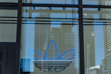 Obraz premium sign inside display window at adidas Originals Store Toronto, The Well located at 486 Front Street West