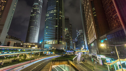 Hong Kong Business District with busy traffic timelapse at night.