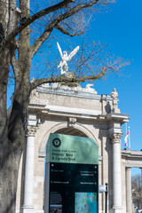 Obraz premium location marker and rear or west facing side of Princes' Gates, a historical landmark, at the eastern most entrance to Exhibition Place in Toronto, Canada