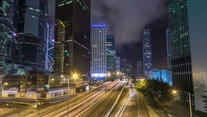 Hong Kong Business District with busy traffic timelapse at night.