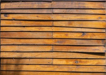 Fototapeta premium Natural wood slats wall or lath line arrange. Flooring pattern surface texture. Close-up of interior architecture material for design decoration background.