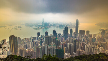 The famous view of Hong Kong from Victoria Peak timelapse. Sunrise with colorful clouds over Kowloon Bay. - obrazy, fototapety, plakaty