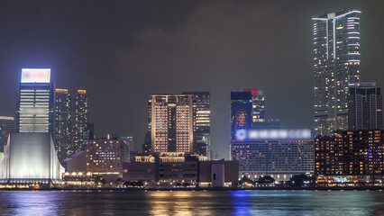 Obraz premium Hong Kong Cultural Centre with colorful light projection on its wall timelapse hyperlapse.