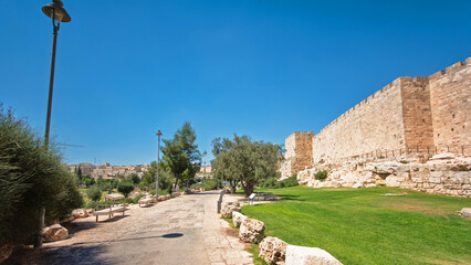 Defensive wall of the ancient holy Jerusalem timelapse hyperlapse, lit by the bright sun.