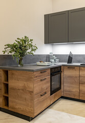 Modern kitchen with wooden and gray cabinets