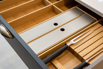 Close-up photo of dividers in modern kitchen drawer