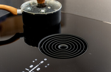 Close-up photo of venting induction hob with built-in central extractor