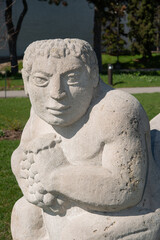 Obraz premium sculpture of figure with grapes at Garden of the Greek Gods (stone object sculpted by EB Cox) at Exhibition Place in Toronto, Canada