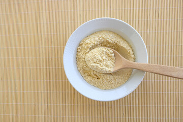 Chickpea flour in bowl, top view