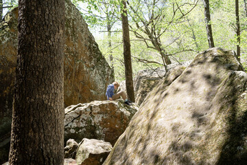 Child sitting On Boulder While Hiking In Buffalo National River