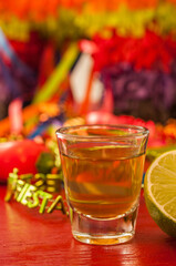 Fiesta-ready tequila shot with lime.