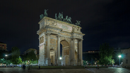 Fototapeta na wymiar Arch of Peace in Simplon Square timelapse hyperlapse at night. It is a neoclassical triumph arch