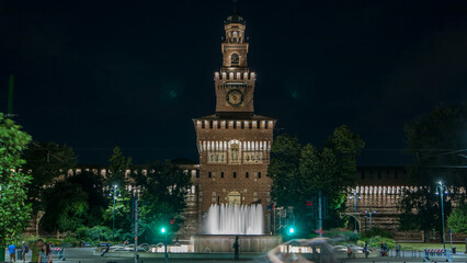 Fototapeta na wymiar Main entrance to the Sforza Castle and tower - Castello Sforzesco night timelapse, Milan, Italy
